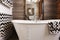 White free standing vintage style bath tub with chevron pattern
