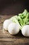 White fresh turnip on the wooden table