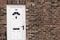 White front door of a red brick English town house. Manchester.