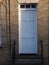 White front door of a terraced house