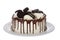 White frosted chocolate cake with chocolate sandwich cookies isolated