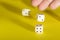 White gaming dices on yellow background. Victory chance and lucky. Place for text. Top view and Close-up cube. Concept business,