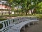 White garden benchs in quiet palace green park