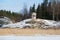 White gazebo on the cliff Sunny February day. View from the lake Ayranne. Sortavala, Karelia