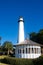 White Gazebo and Lighthouse Under Clear Blue Sky