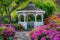 A white gazebo stands amidst a vibrant display of flowers and trees, creating a picturesque scene, A picturesque romantic gazebo