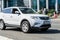 White Geely Boyue Geely Atlas car in motion on urban road. Geely Atlas is a compact crossover SUV of the Chinese automaker Geely