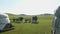 White Ger Tents And Ox Cart Tumbrel in Meadows of Mongolia
