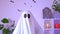 White ghost costume for Halloween party with neon lights in the background. Ghost at confetti party.