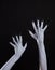 White ghost or witch hands with sharp black nails, body art