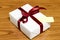 White gift box and red ribbin with tag