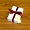 White gift box and red ribbin with tag