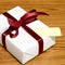 White gift box and red ribbin with tag