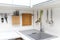 White glossy kitchen interior design with hanging utensils