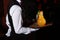 A white-gloved waiter holds a tray of lemonade and microphones. Karaoke in the restaurant. unrecognizable photo with no face, only