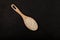 White gluten free vermicelli made from rice flour. Italian pasta in wooden spoon on dark textured background. Top view, space for