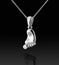 White gold child`s footprint pendant with diamond on black background