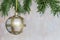 White and gold Christmas decoration bauble balls with pine tree branched