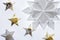 White and gold origami stars and snowflake