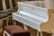 White grand piano, instrument side view, musical instrument. white big piano, concert concept