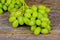 white grapes on a wooden board