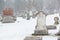 White Grave Stone in Graveyard in the Snow