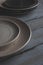 white and gray plates on wooden table