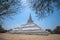 The white great chedi Phu Khao Thong in blue sky