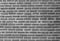 White and grey brick wall texture background with space for text. White bricks wallpaper. Home interior decoration. Architecture