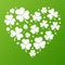 White grunge vector heart made of small shamrock icons