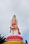 White GuanYin statue on sky background.