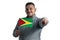 White guy holding a flag of Guyana and points forward in front of him isolated on a white background