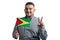 White guy holding a flag of Guyana and shows two fingers isolated on a white background