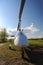 White gyroplane parked on the private airfield