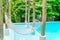 White hammocks in Luxury swimming pool .