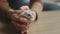 White hamster running in the hands of a young girl