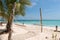 White handmade hammock with palm tree on Zanzibar beach