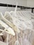 On white hangers clothes for the bride in the salon