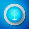 White Hanukkah menorah icon isolated on blue background. Religion icon. Hanukkah traditional symbol. Holiday religion