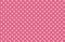 White hearts seamless pattern on pink background.