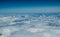 White heavy clouds in the blue sky. Panoramic cloudscape above the clouds