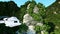 White helicopter flying betweenin Mountains, Cliffs with trees. rescuer. aerial 3d animation.