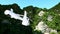 White helicopter flying betweenin Mountains, Cliffs with trees. rescuer. aerial 3d animation.