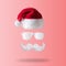 White hipster mustache, sunglasses and hat of Santa Claus on pink background. New Year or Christmas minimal concept