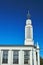 A white, historic modernist building with a tower