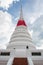 White historical pagoda with a missing lotus statue