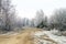 White hoarfrost on trees and road