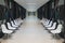 White hospital lobby with a door and white chairs for patients w