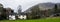 White house amidst lush greenery and trees in a serene field