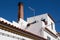 White house with a brick chimney, Alvor, Portugal